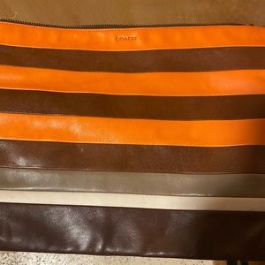 COACH leather clutch.